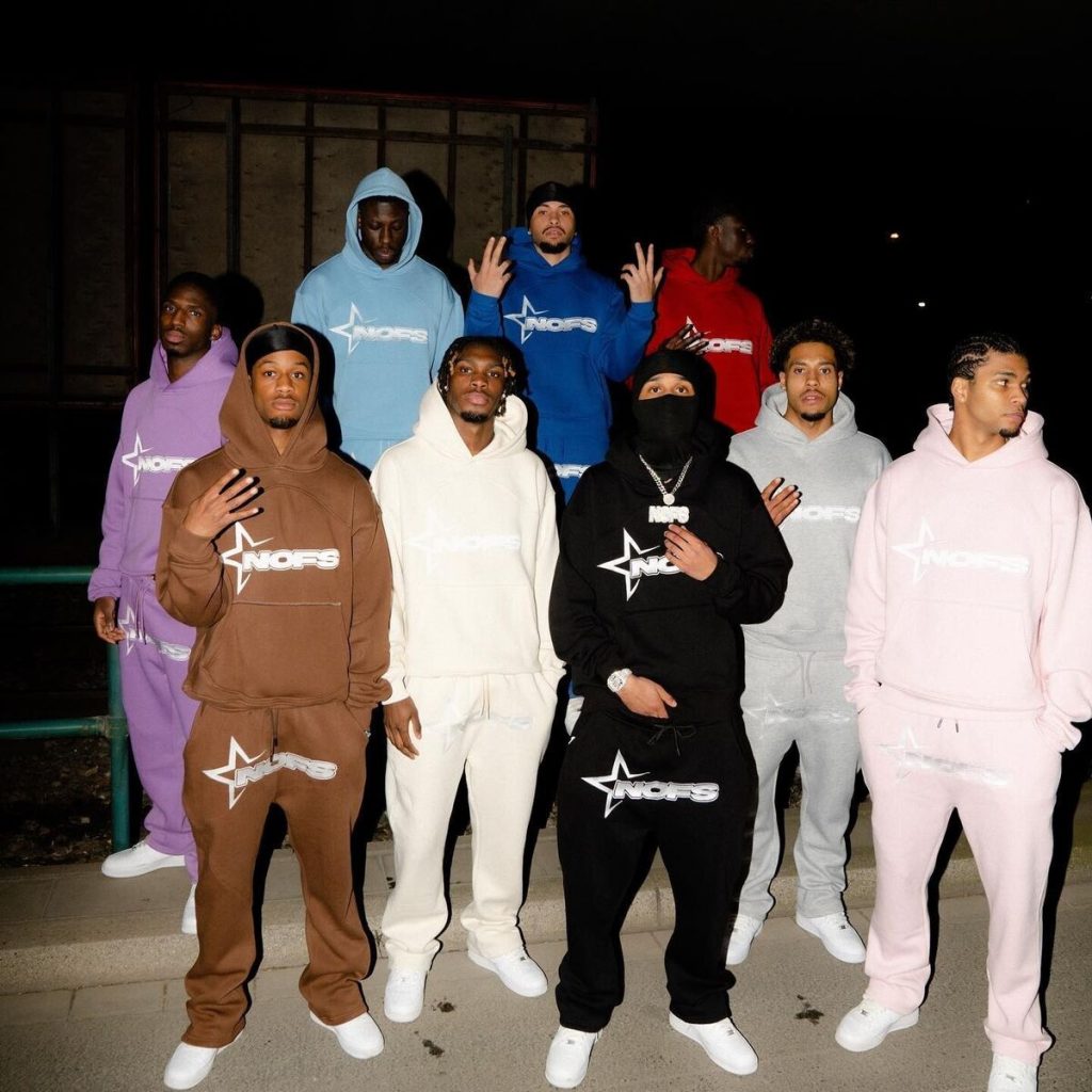 group of men wearing nofs tracksuit